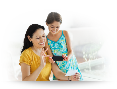 mother and daughter with cell phone and faster money card